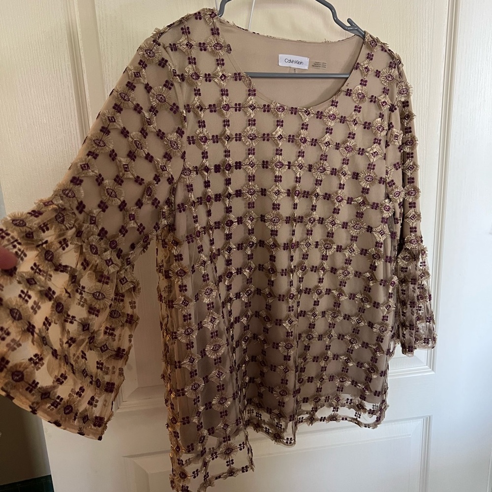 Women Calvin Klein sheer, lined top with a bell sleeve